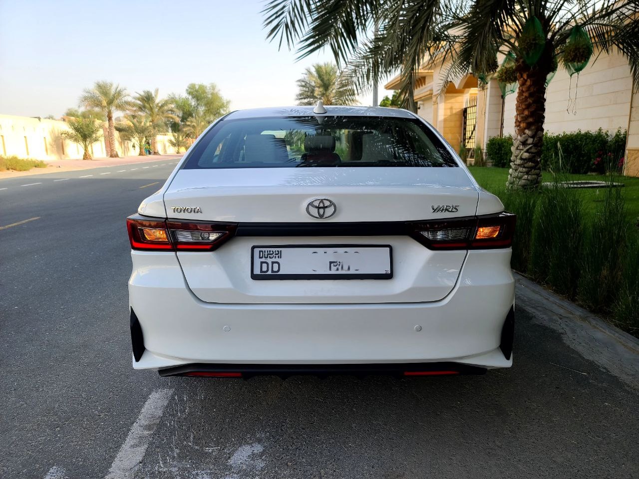 Rear side of Toyota Yaris 2023 parked in Dubai, GCC specs